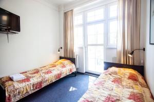 Postel nebo postele na pokoji v ubytování Hostel Wratislavia