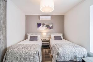 Postel nebo postele na pokoji v ubytování 202 Hotel Boutique