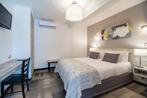 Postel nebo postele na pokoji v ubytování 202 Hotel Boutique