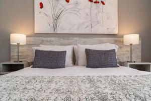 Postel nebo postele na pokoji v ubytování 202 Hotel Boutique