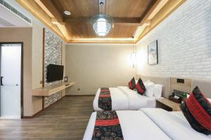TV a/nebo společenská místnost v ubytování Zou Qu Ye Travel Hotel