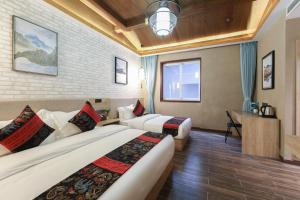 Posezení v ubytování Zou Qu Ye Travel Hotel