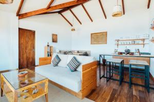 a living room with a couch and a table at Ecolodge La Estancia in Comunidad Yumani