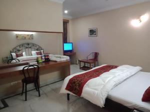 Postel nebo postele na pokoji v ubytování Pamposh Guest House, Gurgaon