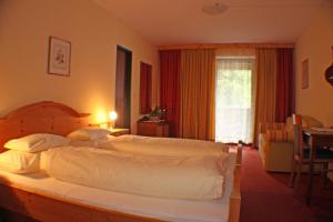 Posteľ alebo postele v izbe v ubytovaní Hotel Mooserkreuz