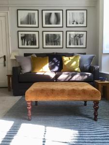 a living room with a couch and a coffee table at Fabulous Apartment in Historic House in St Aubin in Saint Aubin