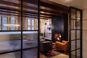 a living room filled with furniture and a fireplace at ROOST Rittenhouse in Philadelphia