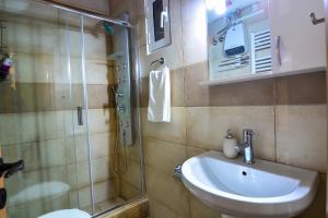 a bathroom with a sink and a shower at The Theater of Dreams in Synikia Mesi Trikalon +32 photos