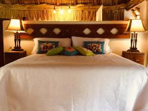 Ліжко або ліжка в номері Hacienda La Rusa