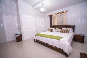 a bedroom with a large bed and a window at Casa Boutique Blessed Place in San Andrés +40 photos