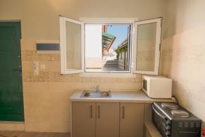 A kitchen or kitchenette at Chandris Apartments