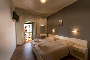 A bed or beds in a room at Chandris Apartments