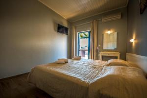 A bed or beds in a room at Chandris Apartments