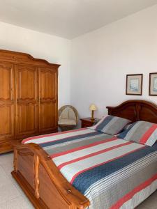 En eller flere senge i et værelse på Casitas Rosheli