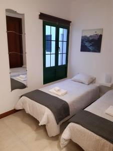 Postel nebo postele na pokoji v ubytování Apartamento Arena
