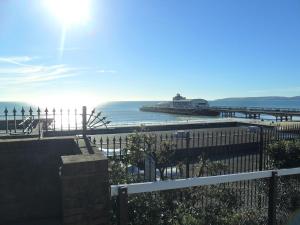 a view of a beach with a pier and the ocean at Cecil Court Hotel in Bournemouth