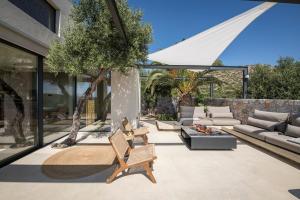 A seating area at OPENNESS House by the sea