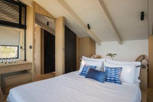 A bed or beds in a room at OPENNESS House by the sea