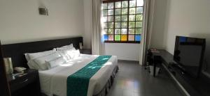 Ένα ή περισσότερα κρεβάτια σε δωμάτιο στο Hotel Union