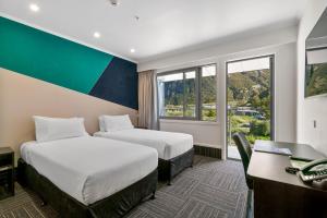 Ein Bett oder Betten in einem Zimmer der Unterkunft Mt Cook Lodge and Motels