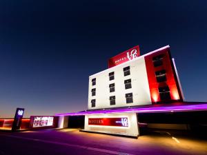 a building with a kfc sign in front of it at Hotel LOVE MODERN in Kitakyushu