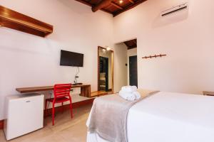 Cama ou camas em um quarto em Pousada Alto da Pipa