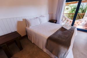 Cama ou camas em um quarto em Pousada Alto da Pipa