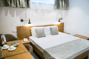 Letto o letti in una camera di R&R Hotel
