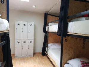 Voodi või voodid majutusasutuse Xplora Hostel Cusco toas