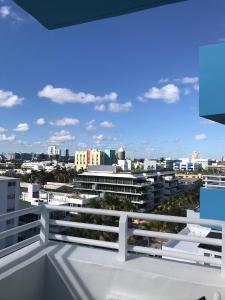 a view of the city from the balcony of a building at Dream Destinations at Ocean Place in Miami Beach