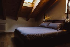 Postel nebo postele na pokoji v ubytování The Cozy Nest - Bellano