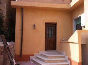 a front door of a house with stairs at Emmevvì in Tropea