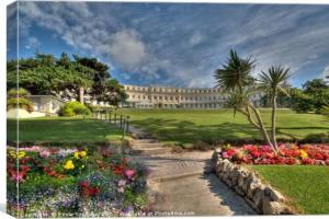 a building with a bunch of flowers in a park at **Sunny and Bright, Thatchers Rock One bed beach front apartment*** in Torquay
