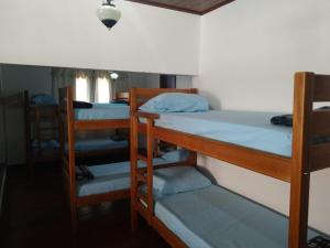 a group of bunk beds in a room at HOSTEL DU SUCA in Petrópolis