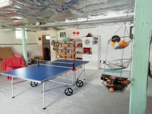 a room with a ping pong table in it at La Maison de Thelma in Bézues-Bajon