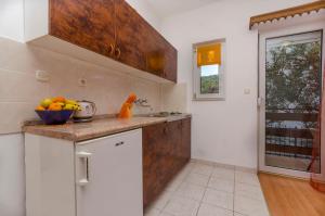Kuchyň nebo kuchyňský kout v ubytování Apartments Tomislav
