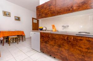 Kuchyň nebo kuchyňský kout v ubytování Apartments Tomislav