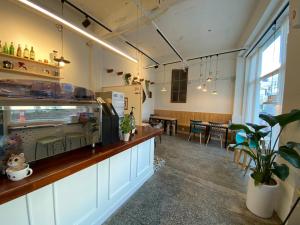 a kitchen with a counter and a dining room at Dante House in Busan