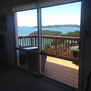 a view of a balcony with a view of the water at Panorama Heights Apartment in Paihia