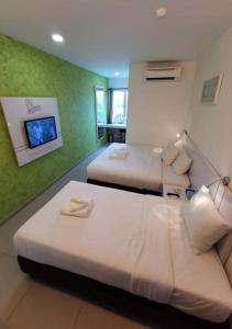Postel nebo postele na pokoji v ubytování Yew Boutique Hotel + 37 fotografií