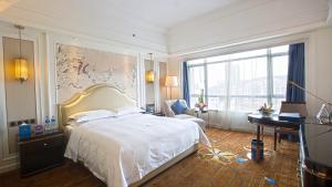 Ένα ή περισσότερα κρεβάτια σε δωμάτιο στο Shenzhen Dayhello international Hotel (Baoan)