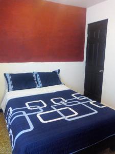 Cama o camas de una habitación en Pensión Aguayo