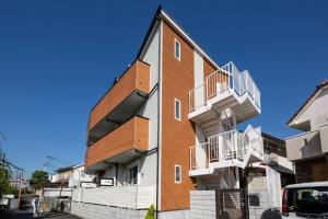 a building with balconies on the side of it at Credo Maison Kamakura102 in Kamakura