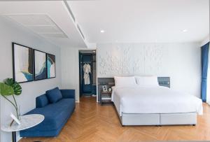 Una cama o camas en una habitación de Amanta Hotel & Residence Sathorn
