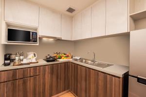 Una cocina o cocineta en Amanta Hotel & Residence Sathorn