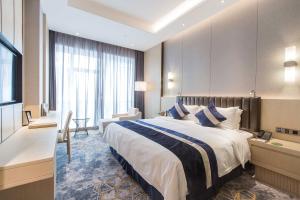 Voodi või voodid majutusasutuse Chongqing Liyuan Hotel toas
