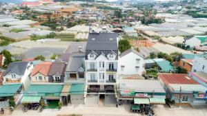 an aerial view of a town with buildings at An AN Diamond Hotel in Da Lat