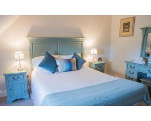 A bed or beds in a room at East Clare Golf Village