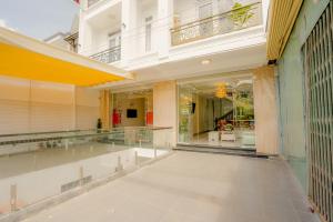 a hallway of a building with glass windows at An AN Diamond Hotel in Da Lat