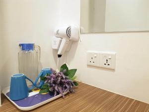 a room with a hair dryer on a table at Casa 96 Villa in Kuantan